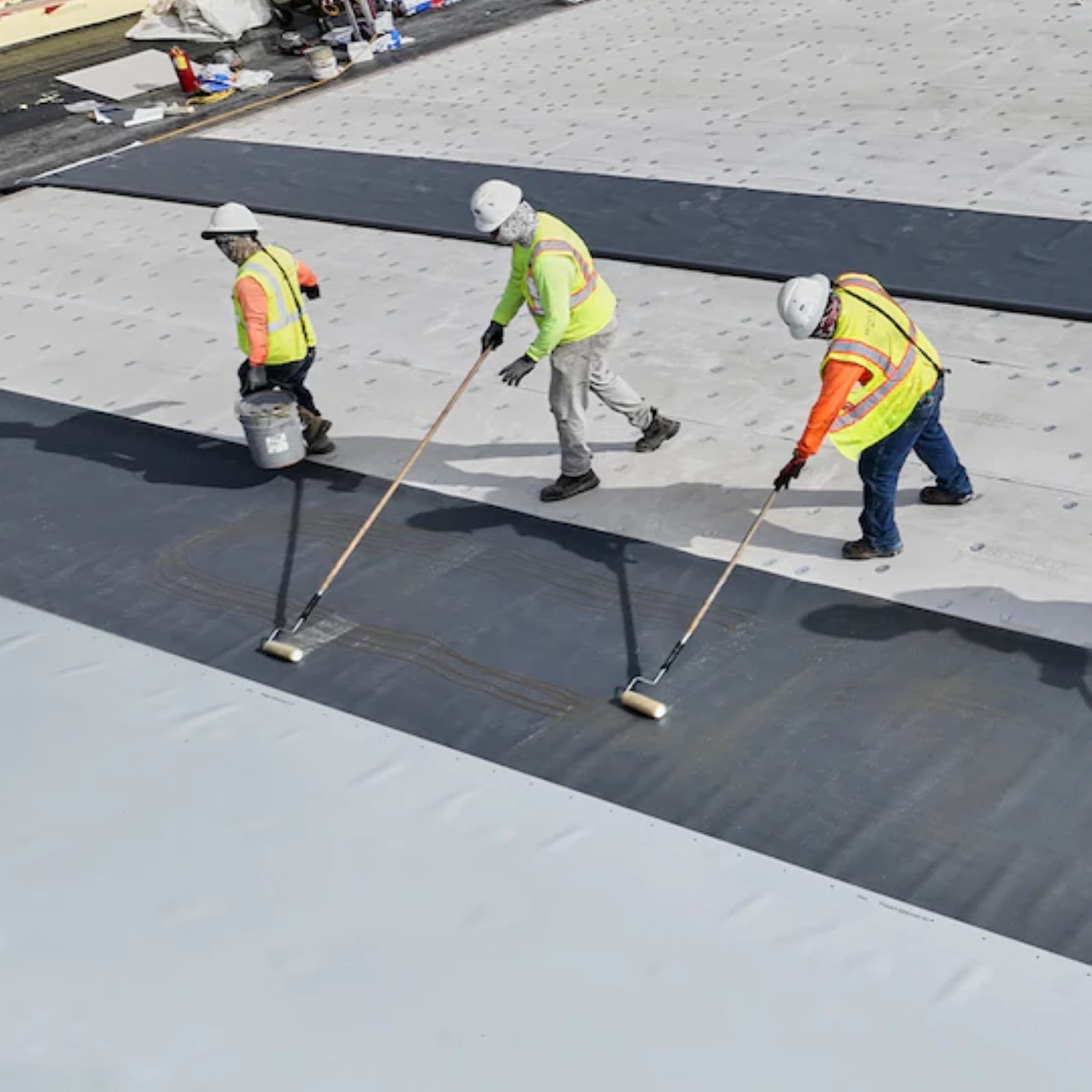 SNV Contracting Group crew applying commercial roof coating